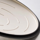 Tramontina Bestow 5.5 Qt Enameled Cast Iron Round Dutch Oven with Lid - Medium Blue-Non Stick Cooking Surface: Off-white porcelain enamel interior provides an easy-to-clean, nonstick surface that's safe for all types of cooking