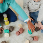 Miniland Towering Wooden Stones-Develops visual and spatial abilities.