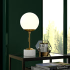 Hudson&Canal Reagan 17.75" Tall Table Lamp with Glass Shade - Brass/ White Marble/White Milk-Rated for one 60W incandescent bulb - 9W LED bulb, 13W fluorescent (CFL) bulb, or 9W self-ballasted LED bulb, E26-base bulb, Bulb not included