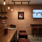 Frameworth Nathan MacKinnon Replica Signature Hockey Canada 2026 - Framed Print - 16" x 20"-High-quality action photograph showcasing MacKinnon in Hockey Canada colours with replica signature detail. Professional black wood composite frame with glass front protection