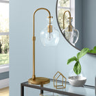 Hudson&Canal Verona 27" Tall Arc Table Lamp with Glass Shade - Brushed Brass/Seeded-Handcrafted brushed brass finish is applied to the geometric metal base
