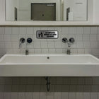 Cosco Employees Must Wash Hands Sign - Brushed Metal - 3" x 9" - Indoor Restroom Sign - French Text-The brushed metal finish provides a clean, modern appearance suitable for restrooms in commercial environments