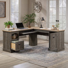 Sauder Sonnet Springs L-Desk - Pebble Pine-Storage area behind door holds vertical CPU tower and has an adjustable shelf