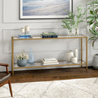Hudson&Canal - Console Hera 64" de largeur avec étagère en verre - Laiton brossé-Une finition en laiton brossé fabriquée à la main est appliquée sur le cadre en acier