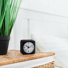 Marathon Watch Mini Non-Ticking Analog Alarm Clock with Auto Back Light and Snooze Function - Black/White-Auto-night light: an ambient light sensor triggers a soft glow to illuminate the dial when placed in low light.