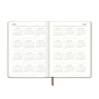 Orange Circle Studio Dots on Chai Medium Dual-Textured Weekly/Monthly Planner - 1 5.6" x 7.6" - Brown - Bilingual-Includes spacious monthly views, weekly views, and notes pages 