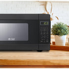 Commercial Chef 0.9 cu. ft. 900W Countertop Microwave - Black-Impressive Features: When it comes to countertop microwave ovens, our white microwave cooker is superior with 900 watts of power, a convenient push button, turntable roller, glass tray, & wave guide.