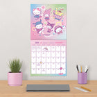 DateWorks 2026 16-Month Wall Calendar - 12" x 12" - Hello Kitty - Bilingual-Features monthly pages for January to December 2026, as well as the last 4 months of 2025