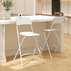HOMCOM Folding Bar Stools with Footrest - White - 2 Pack-Folds flat for quick storage, suitable for small kitchens or compact living spaces
