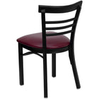 Chaise de restaurant de la série HERCULES en métal noir avec dossier échelle à trois lattes - Siège en vinyle bourgogne-Siège rembourré de 2.5 po en mousse épaisse