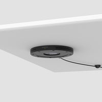 Humanscale NeatCharge-No touchpoints - simply place your mobile device on the table to charge.