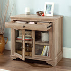 Sauder 431439 Rollingwood Library Base - Brushed Oak-Adjustable shelf behind framed, safety-tempered glass doors accommodates items of various heights.