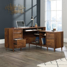 Sauder 59"W Clifford Place L-Desk - Grand Walnut-Three drawers with metal runners and safety stops conceal miscellaneous office supplies