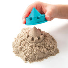 Kinetic Sand Folding Sand Box-Won't stick to anything but itself. No sand on your hands, clothes.  It leaves your hands completely dry and never greasy.