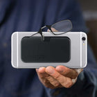 ThinOptics Unisex's Universal Pod Reading Glasses - +2.50 Strength - Black Frame with Black Case -Strength: Every ThinOptics Reader is made of shatterproof, thermo-injection molded, optical-grade polycarbonate. The bridge is made from a shape-memory metal called Nitinol, which is 10x more elastic than spring steel and encased in medical-grade silicone tubing