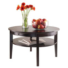 Winsome Amelia Round Coffee Table with Pull Out Tray-Table bottom shelf has 24.80” diameter. Constructed with combination of Solid and composite wood in Dark Espresso Finish