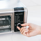Ninja Foodi 8-in-1 Digital Air Fry Oven - Stainless Steel/Black-45 percent larger usable pan cooking area, easily fits a 13" pizza, up to 9 slices of toast or 6 chicken breasts (6-8 oz each)