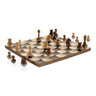 Umbra Wobble Chess Set - Walnut-Umbra's Wobble chess set has a concave landscape which causes the chess pieces to wiggle and helps them stay in place when the board is moved