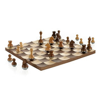 Umbra Wobble Chess Set - Walnut-Umbra's Wobble chess set has a concave landscape which causes the chess pieces to wiggle and helps them stay in place when the board is moved