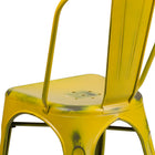 Flash Furniture Distressed Yellow Metal Indoor-Outdoor Stackable Chair-Drain Holes in Seat