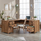 Sauder 66"W Cannery Bridge L-Desk - Sindoori Mango-Top features herringbone pattern for added detail